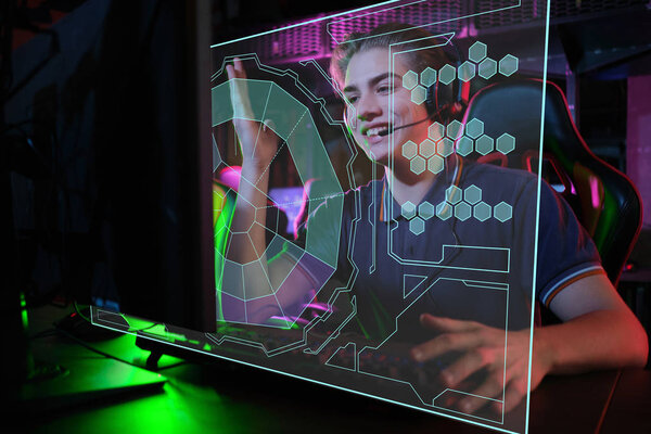 Professional young caucasian gamer playing online on his PC. He upset because of losing the game