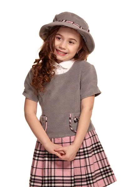 Studio shot of a lovely little kid with a long, curly hair posing isolated on white background. — Stock Photo, Image