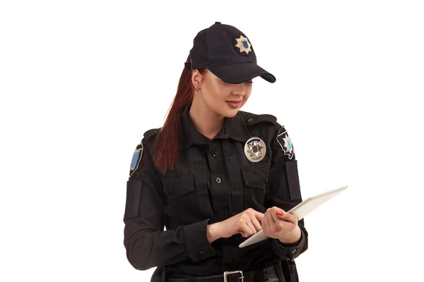 Close-up portrait of a female police officer is posing for the camera isolated on white background. — Stock Photo, Image