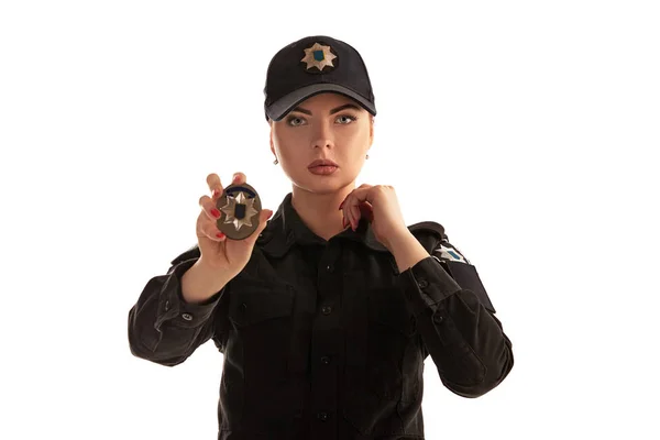 Close-up shot of a redheaded female police officer posing for the camera isolated on white background. — Stock Photo, Image