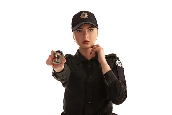 Close-up shot of a redheaded female police officer posing for the camera isolated on white background. — Stock Photo, Image