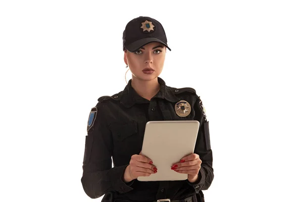 Close-up shot of a redheaded female police officer posing for the camera isolated on white background. — Stock Photo, Image