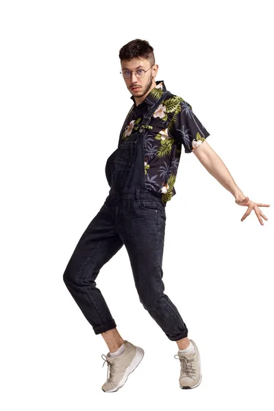 Full-length portrait of a funny guy dancing in studio isolated on white background. — Stock Photo, Image