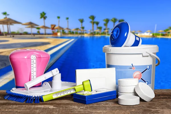 Equipment with chemical cleaning products and tools for the maintenance of the swimming pool. — Stock Photo, Image