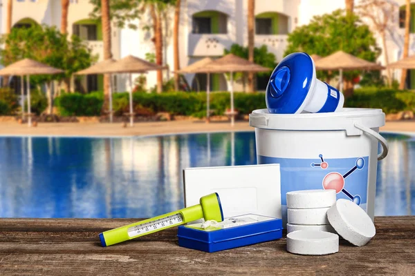 Equipment with chemical cleaning products and tools for the maintenance of the swimming pool. — Stock Photo, Image