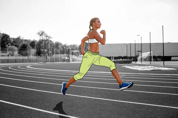 Woman athlete in a cartoon sport clothes is running by the track of a professional stadium. — Stock Photo, Image