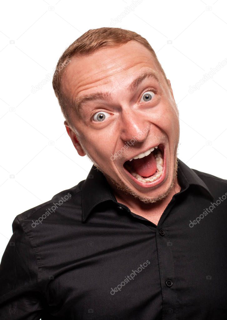 Handsome young blond man in a black shirt, isolated on a white background