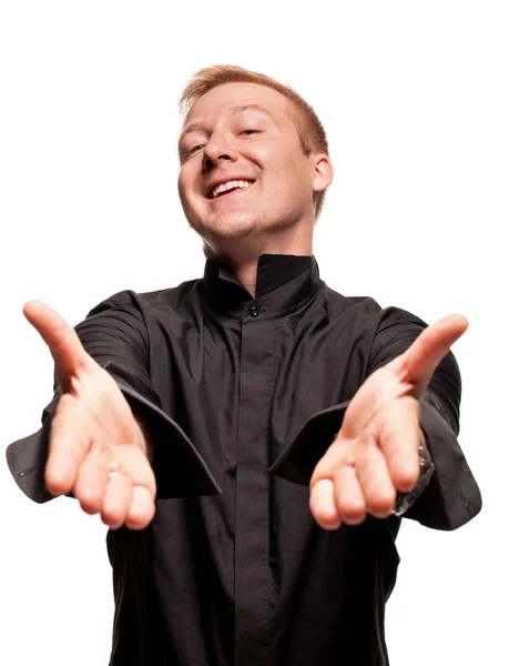 Jonge blonde man in een zwart shirt, horloges en armband maakt gezichten, geïsoleerd op een witte achtergrond — Stockfoto