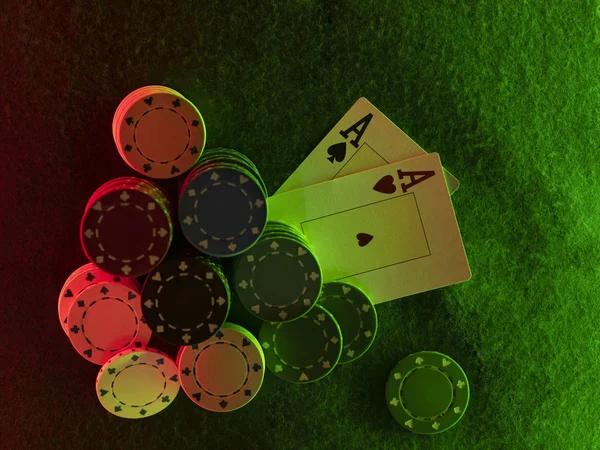 Close-up top view photo of two aces and chips laying on green cover of playing table, against black background, under green and red neon lights. — Stock Photo, Image