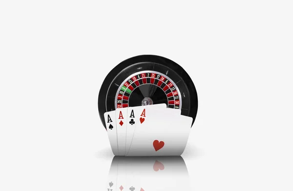 Close-up photo of four aces standing ahead of a black roulette, isolated on white background. Playing cards. Gambling entertainment. — Stock Photo, Image