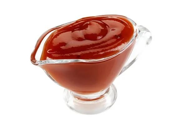 Ketchup sauce in a glass sauceboat isolated on white background with copy space for text or images. Spices and herbs. Close-up shot. — Stock Photo, Image