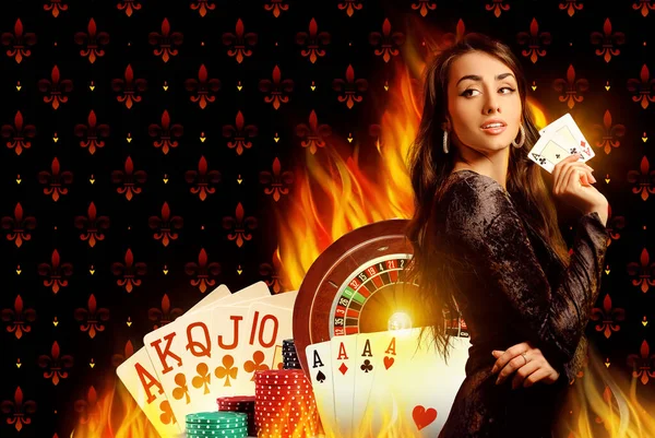 Smiling model in black dress showing two aces. Posing on colorful background with playing cards, roulette and chips. Poker, casino. Close-up — Stock Photo, Image