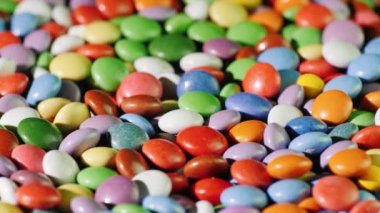 Renkli şeker, parlak arka planını sır yuvarlak şekerler