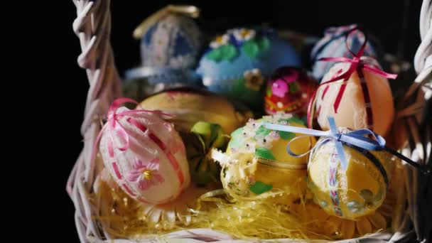 Basket with Easter decorations on a black background — Stock Video