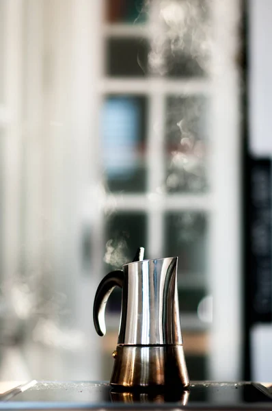 Italian steam coffee maker on induction stove
