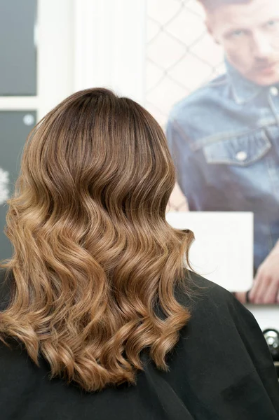 hairstyle female curls on dark hair close up