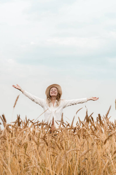 Blonde woman in a wheat field