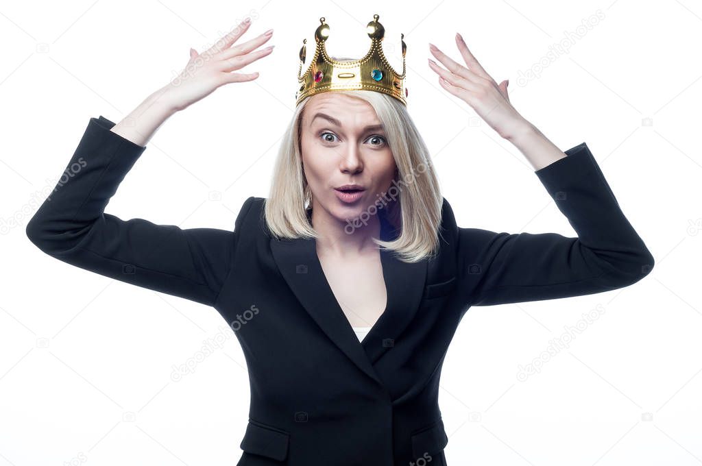 Blond girl with crown on head on white backgroun