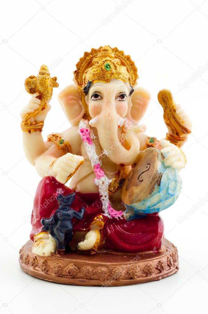 Gilded figure of the elephant Ganesha on white backgroun