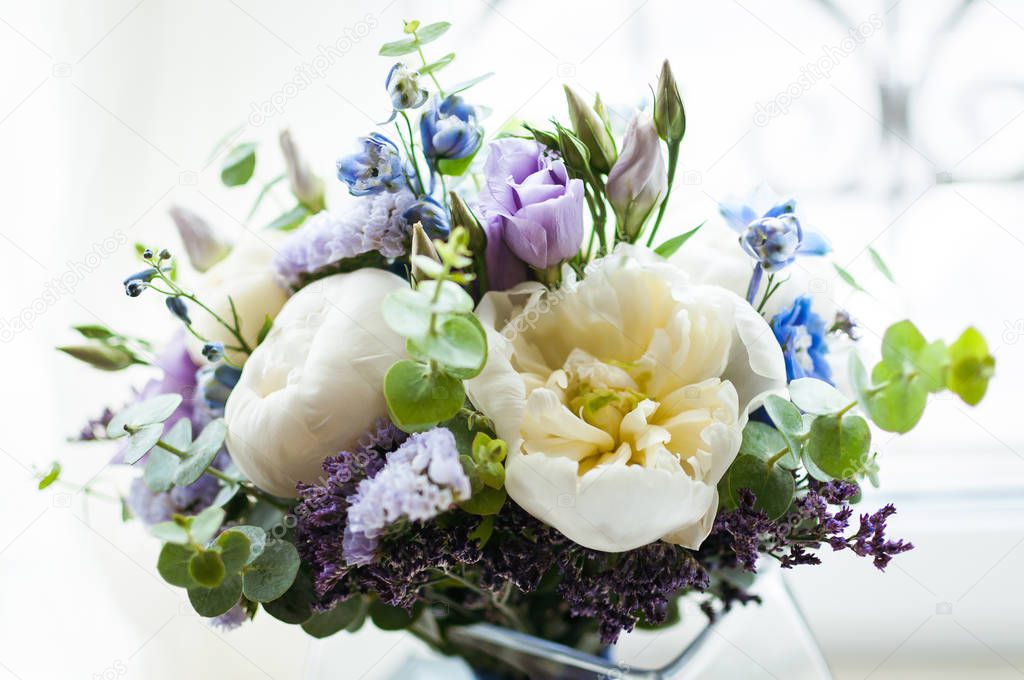 Wedding bouquet of flowers on a white backgroun