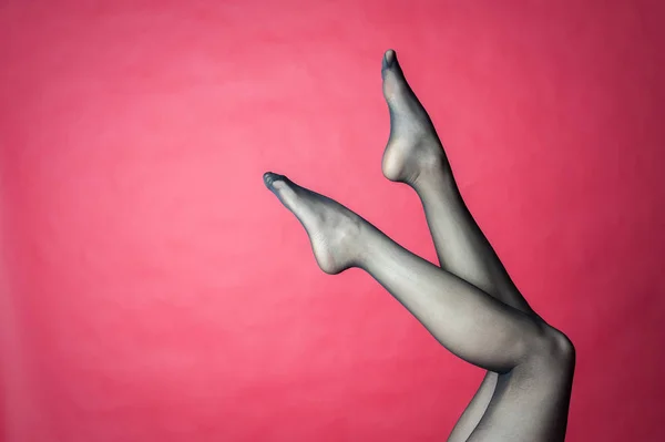 Legs of young caucasian woman in black tights — Stock Photo, Image