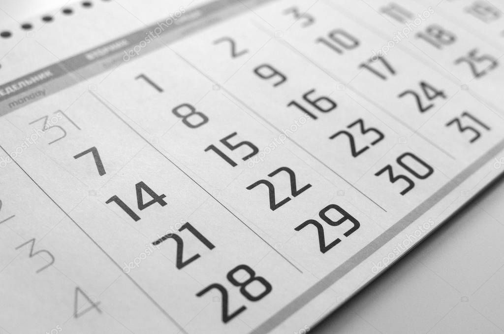 Black and white calendar grid is on the table
