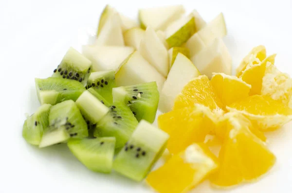 Pieces of fruit are on a white background