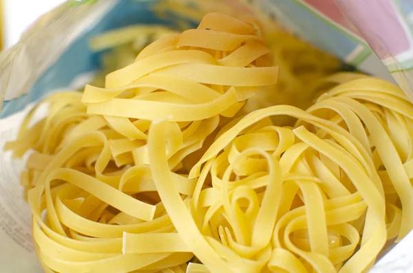 Uncooked Fettuccine Package Table — Stock Photo, Image