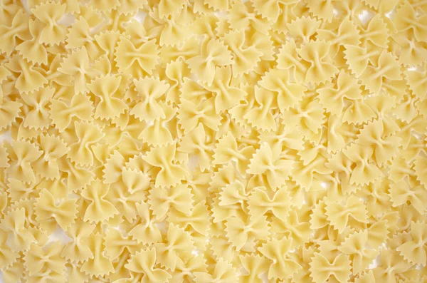 Italian uncooked pasta. Raw farfalle. Healthy food. Italian dishes.