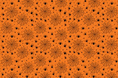 Siyah örümcekler ve örümcek ağlarıyla cadılar bayramı turuncu arka planı