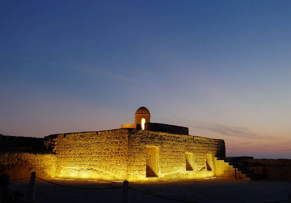 Ancient rooms and watch towers of Bahrain Fort during blue hours