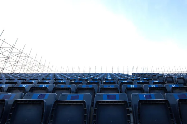 Fixing of chairs and seating arrangement on grandstand for a event