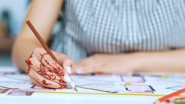 Close up of female architect drawing out and then cutting component for design project. — Stock Video