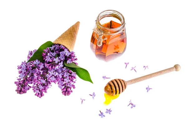 Bio méz a pohár jar, lila orgona — Stock Fotó