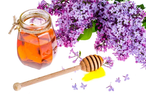 Organic honey in glass jar, purple lilac — Stock Photo, Image