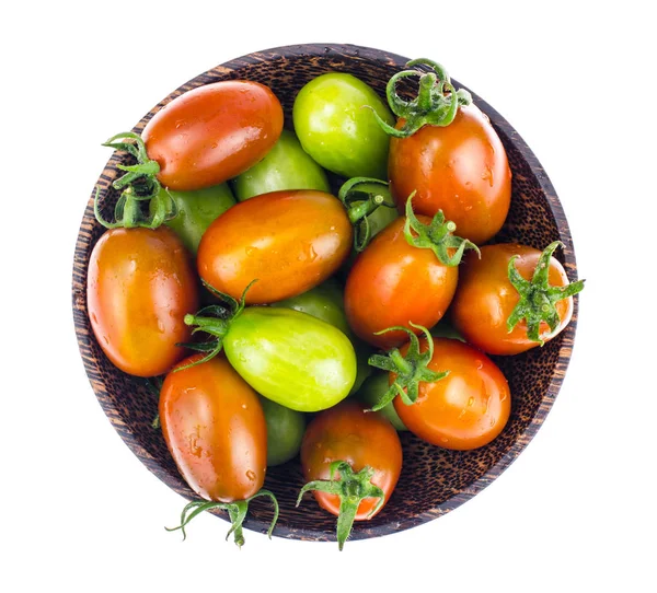 Wooden bowl with mature and immature tomatoes — Stock Photo, Image