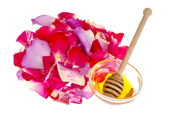 Pétalos de rosa y miel sobre fondo blanco —  Fotos de Stock
