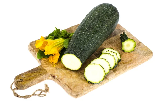 Zucchini on kitchen cutting board, sliced, ingredients for cooking — Stock Photo, Image