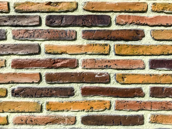 Decorative wall of colored stone bricks — Stock Photo, Image