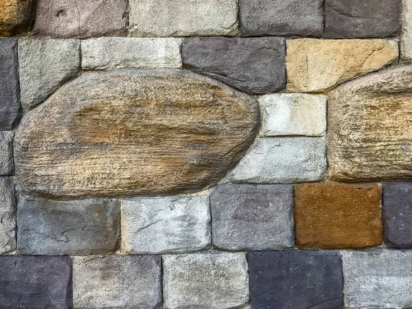 Decorative wall of colored stone bricks