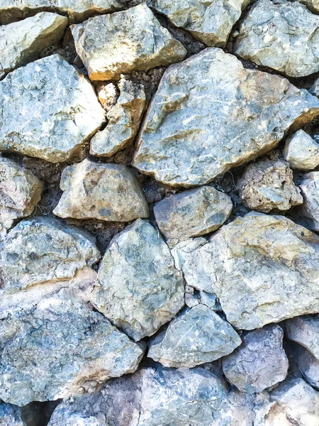 Texture, fond, mur de grandes pierres naturelles non traitées — Photo