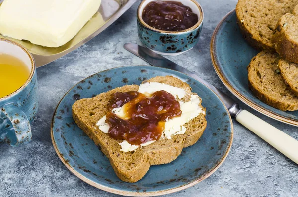 Toast with butter and jam for breakfast on table. Studio Phot