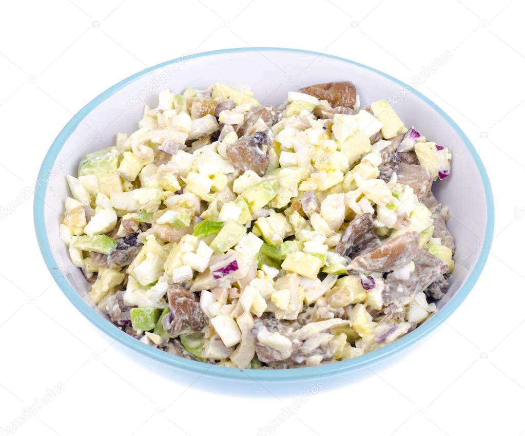 Healthy and dietary food. Salad with avocado, squid and egg. Studio Photo