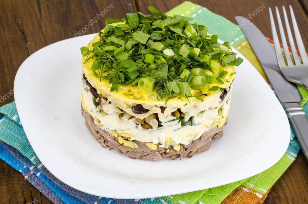 Layered portion salad with meat, cucumber, egg and mayonnaise. Studio Phot