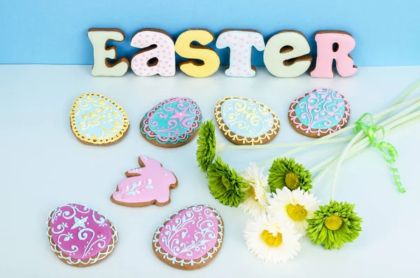 Bright Easter background.  Decoration eggs and colorful letters forming words  EASTER. Celebration concept. — Stock Photo, Image