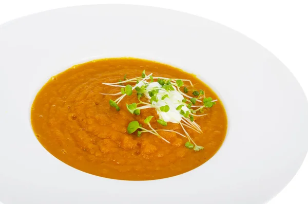 Vegetarian pumpkin soup puree with cress salad greens. — Stock Photo, Image