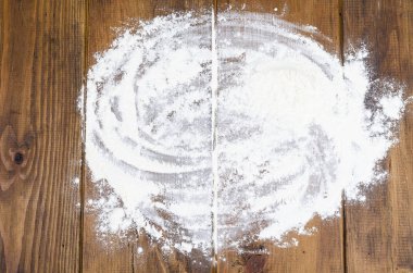 Kahverengi ahşap masa üzerinde un ile pişirme arka plan