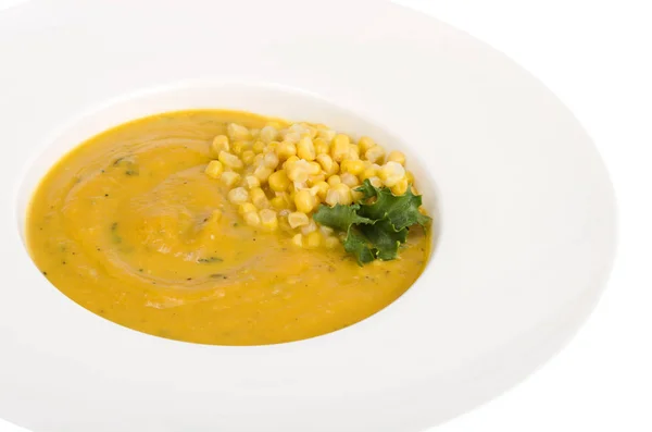 Vit tallrik med majs mosar soppa — Stockfoto