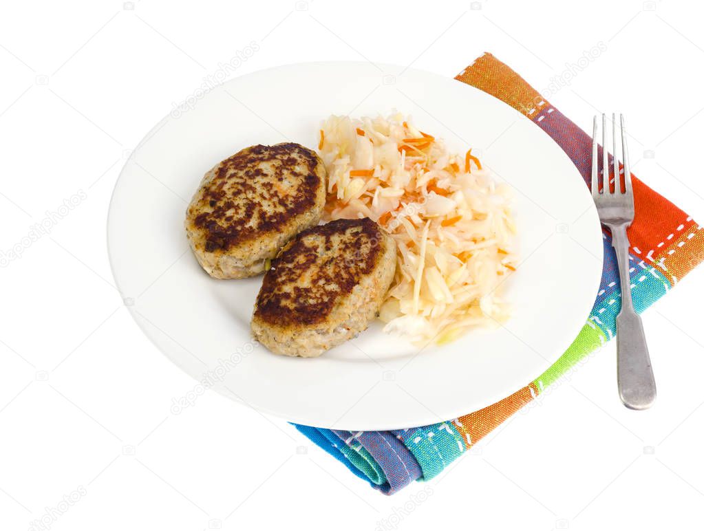 Pickled cabbage with cutlets oa white plate