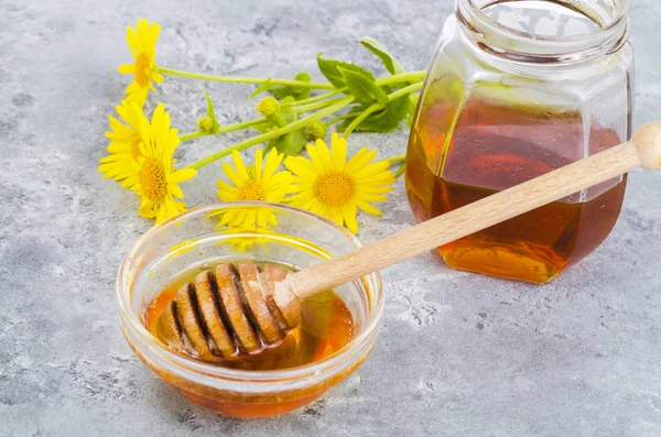 Aromatic flower honey, wild flowers on gray background. — Stock Photo, Image